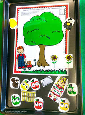 speech therapy cookie sheet activity with printed apples, baskets and an apple tree mat.