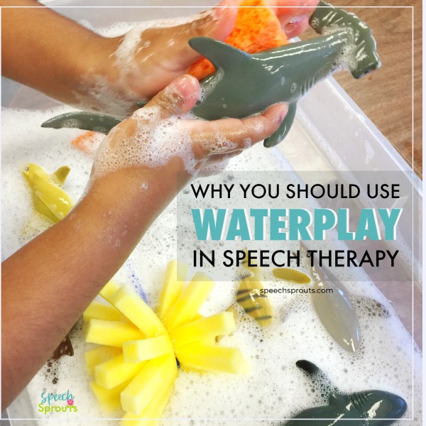A child's hands washing a toy shark in soapy water. Why you should use waterplay in preschool speech therapy.